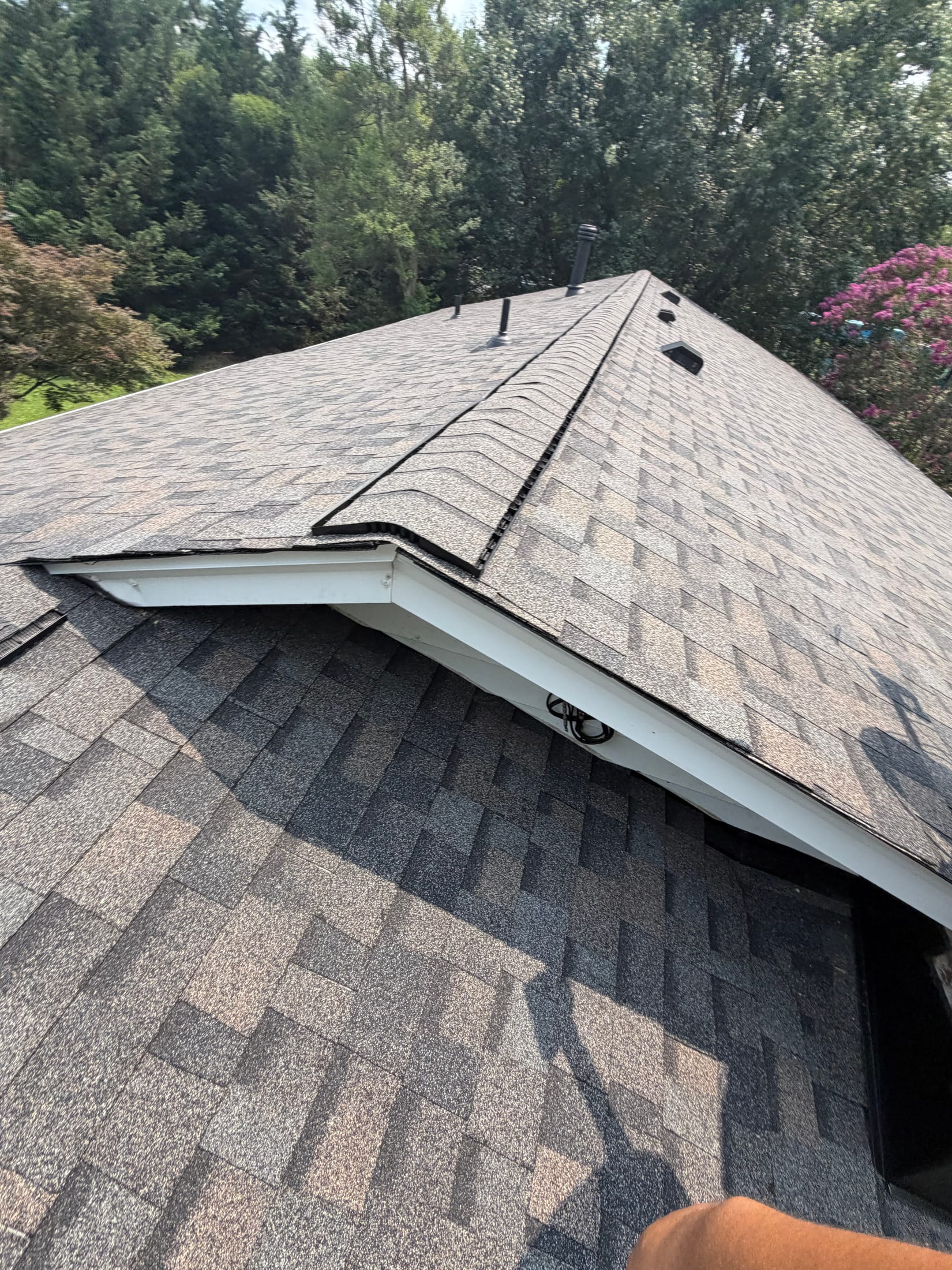 Close view of a completed gray architectural shingle roof