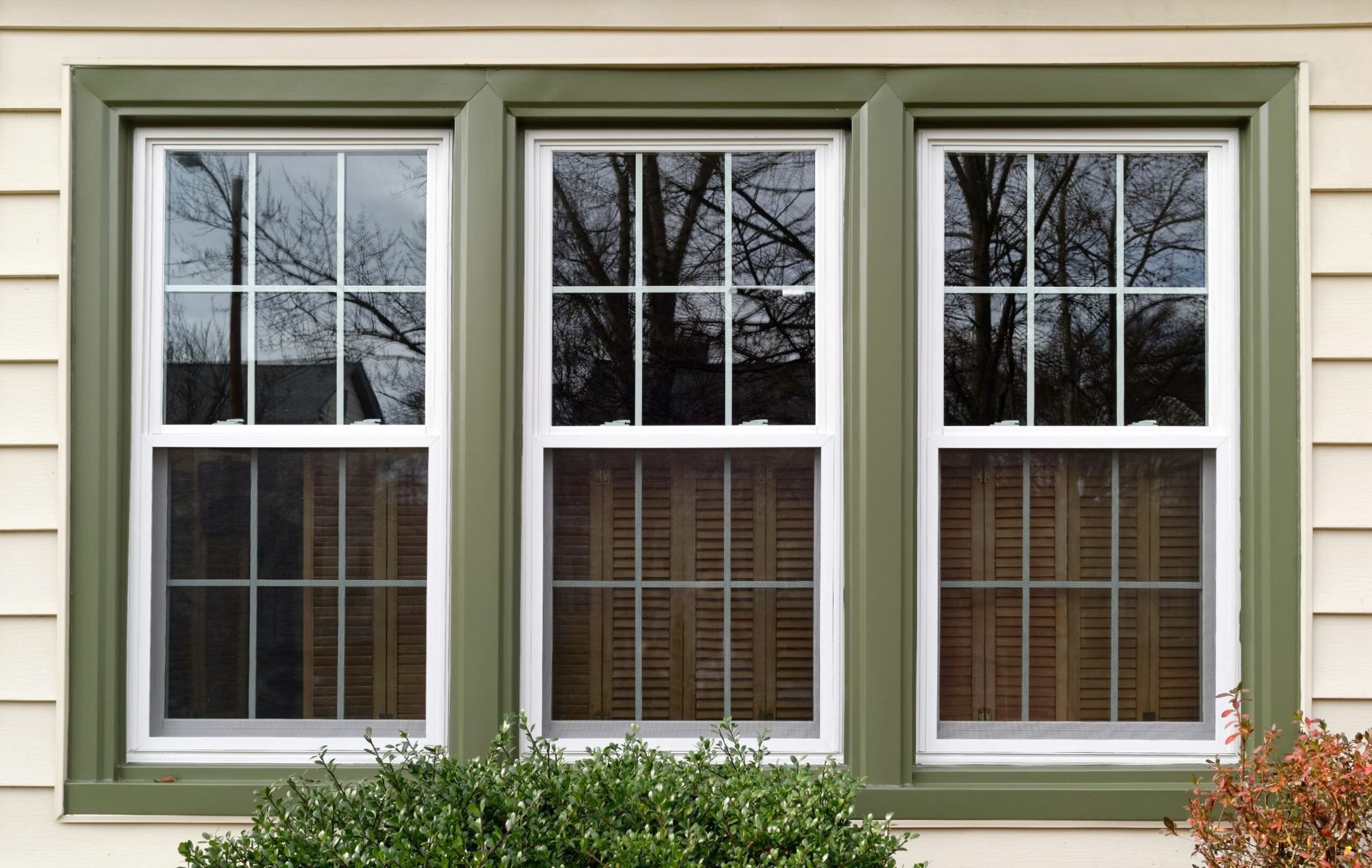 Three newly installed white replacement windows